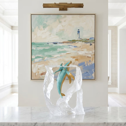Breath of Life Whale Sculpture by Kitty Cantrell. Positioned on white marble table with abstract painting in background