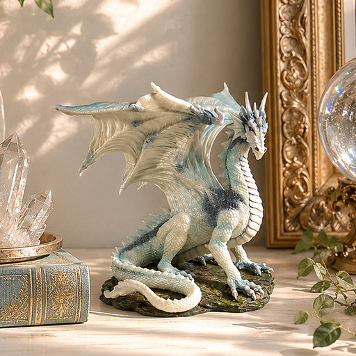 small dragon statue on table
