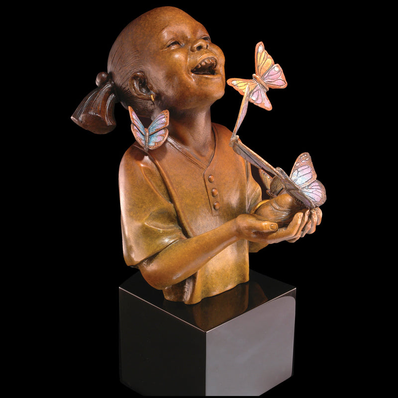 Bronze sculpture of an African American girl with butterflies around her, set against a dark background.