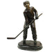 Bronze Boy Playing Hockey Statue