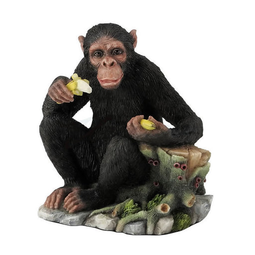 Chimpanzee Eating Bananas by Tree Stump Statue