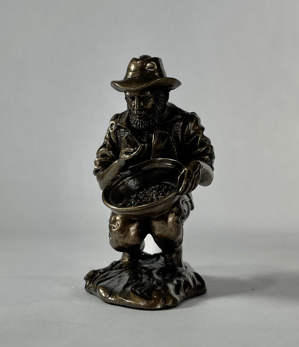 prospector panning for gold statue 