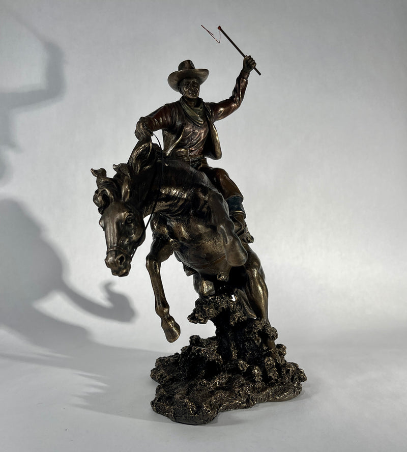 Bucking Bronco with Cowboy Statue
